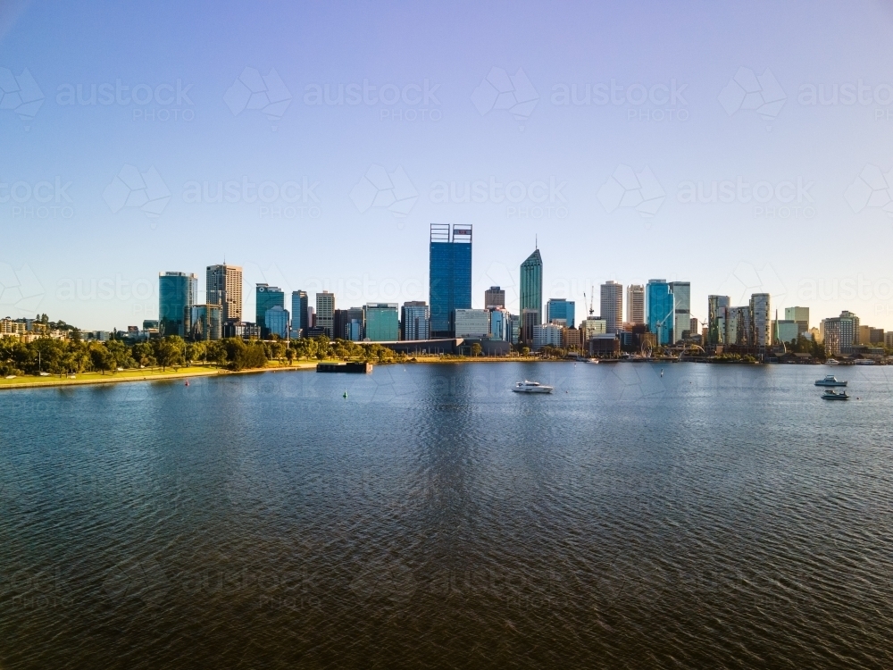 Perth city skyline with views across the Swan River on sunny day - Australian Stock Image