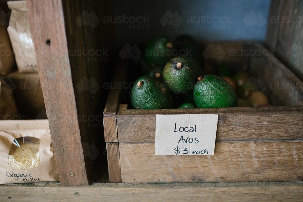 Horizontal shot of local avocadoes in a crate, - Australian Stock Image