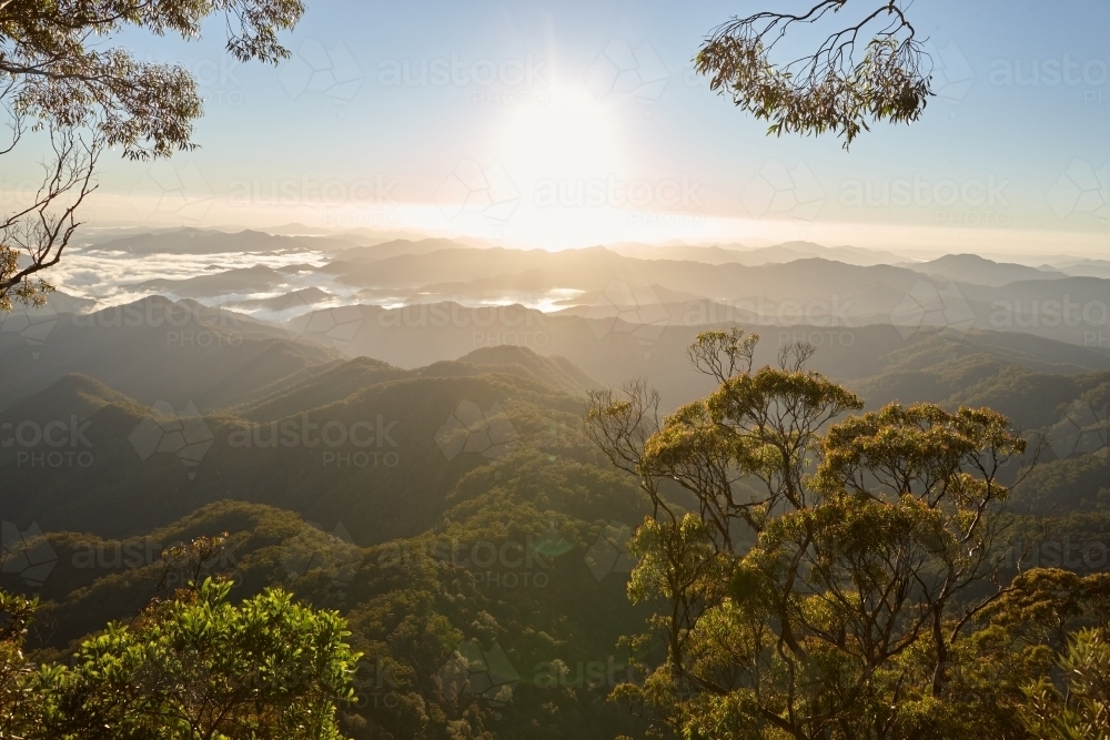 Horizontal shot of mountain tops at sunrise - Australian Stock Image