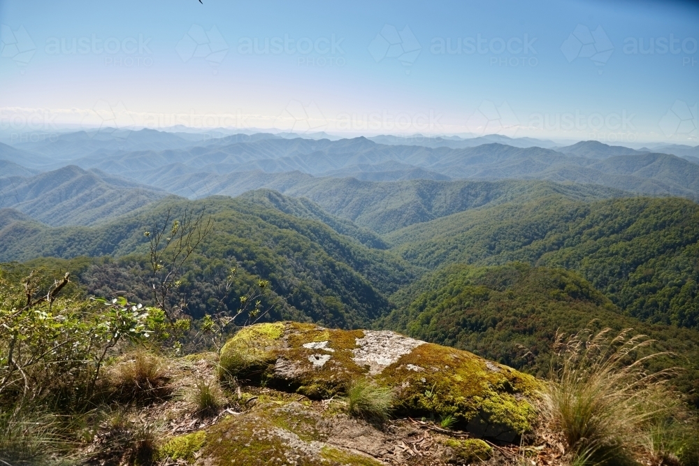 Horizontal shot of mountain tops on a sunny day - Australian Stock Image