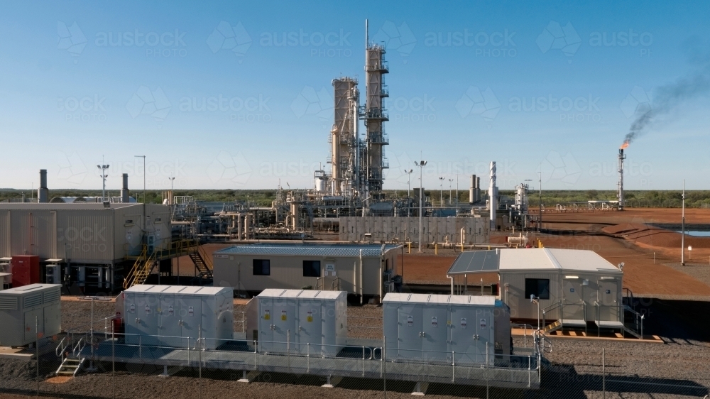 Horizontal shot of office-built and storage cranes inside an industrial plant - Australian Stock Image
