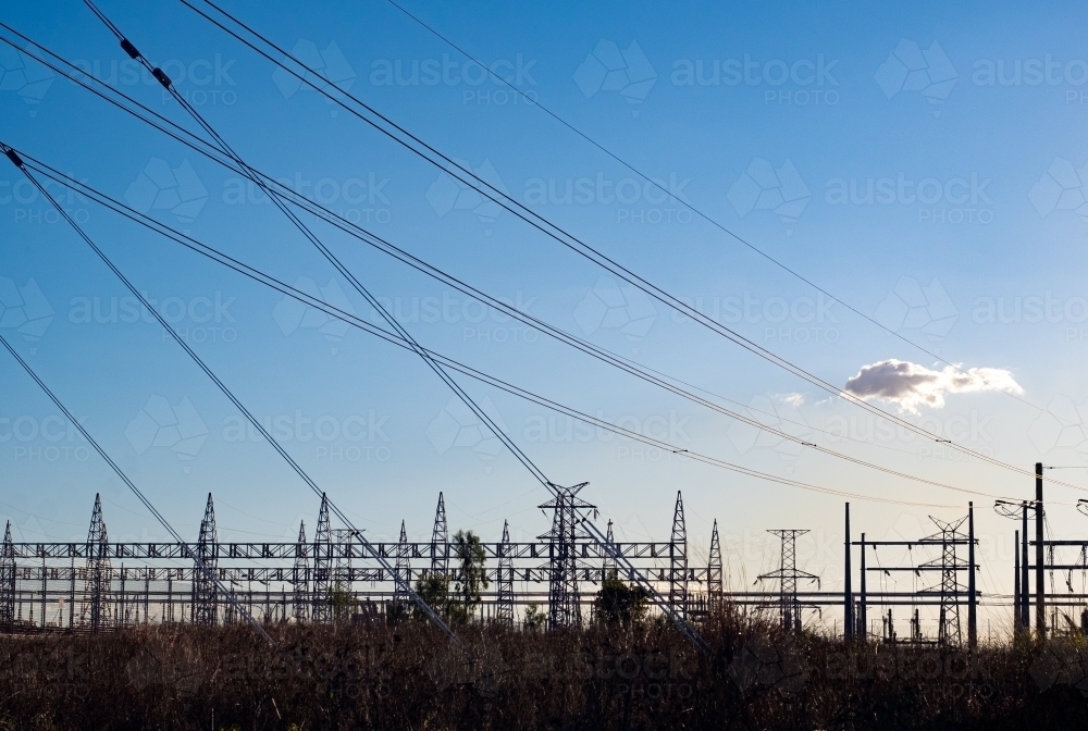 Horizontal shot of power lines at sunset - Australian Stock Image