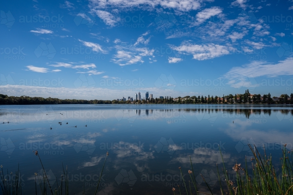 Horizontal shot of river with a reflection of the sky - Australian Stock Image