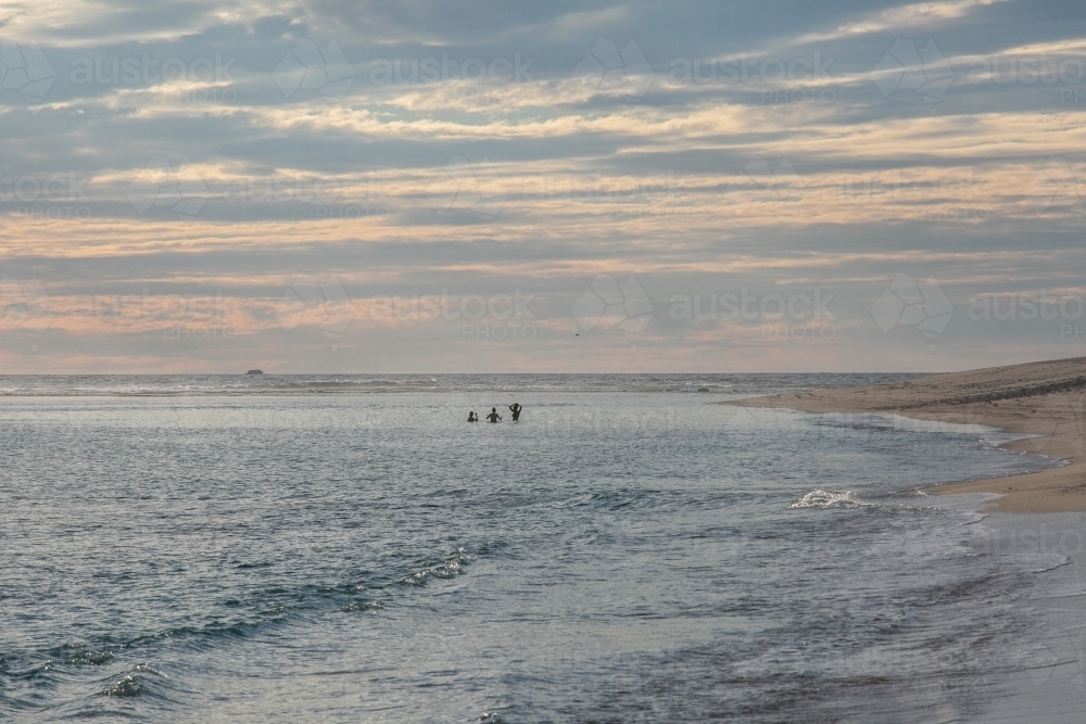 Horizontal shot of sea shore at sunset. - Australian Stock Image