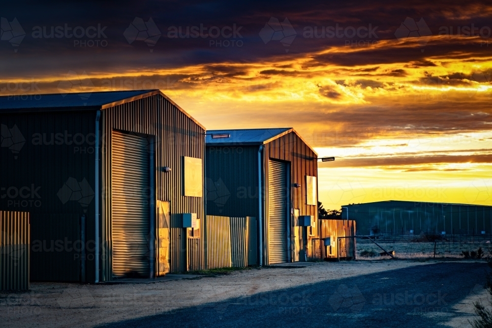 Horizontal shot of two garage sheds at sunlight - Australian Stock Image