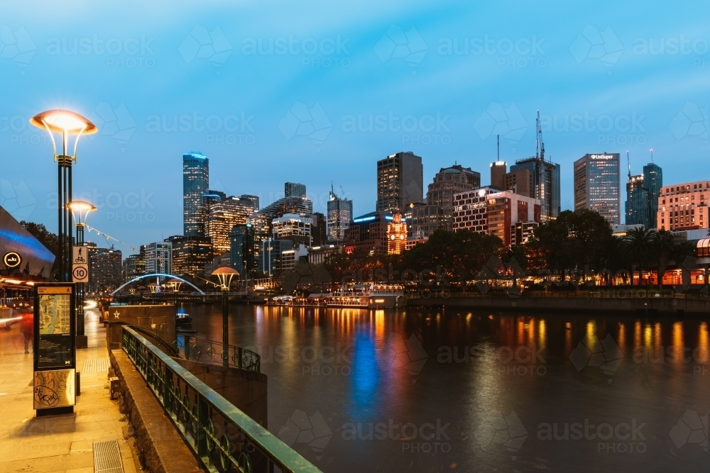 Horizontal shot of Yarra river and city buildings in the evening - Australian Stock Image