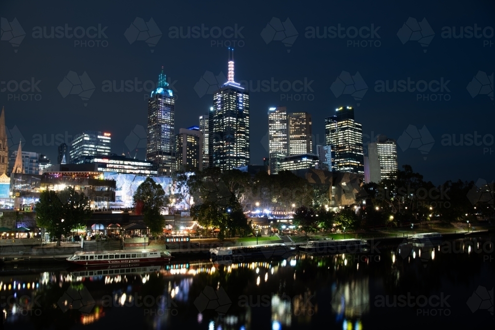 Horizontal shot of Yarra river and city buildings in the evening - Australian Stock Image
