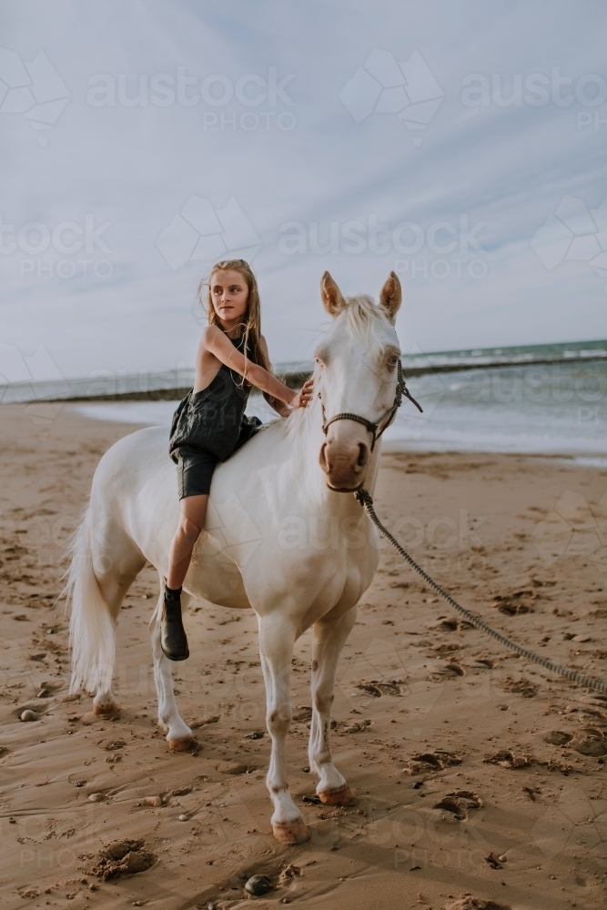 Horse riding on beach - Australian Stock Image