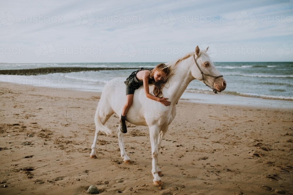 Horse riding on beach - Australian Stock Image