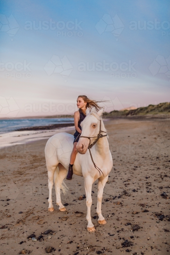 Horse riding on beach - Australian Stock Image