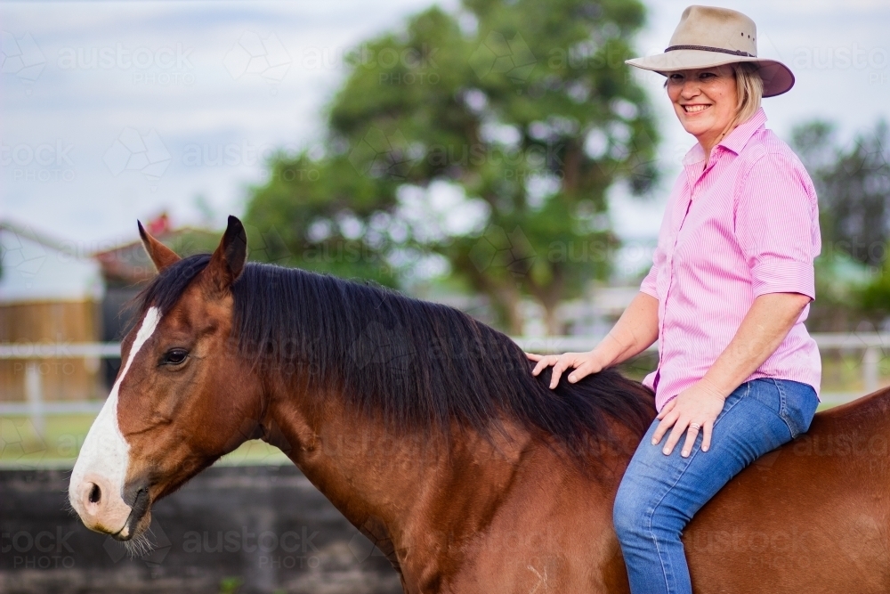 Horsewoman sitting on her horse bareback - Australian Stock Image