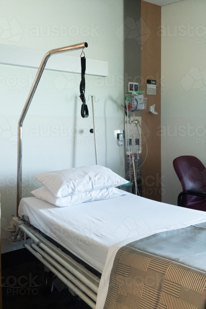 Image of Hospital bed with disability aid Austockphoto