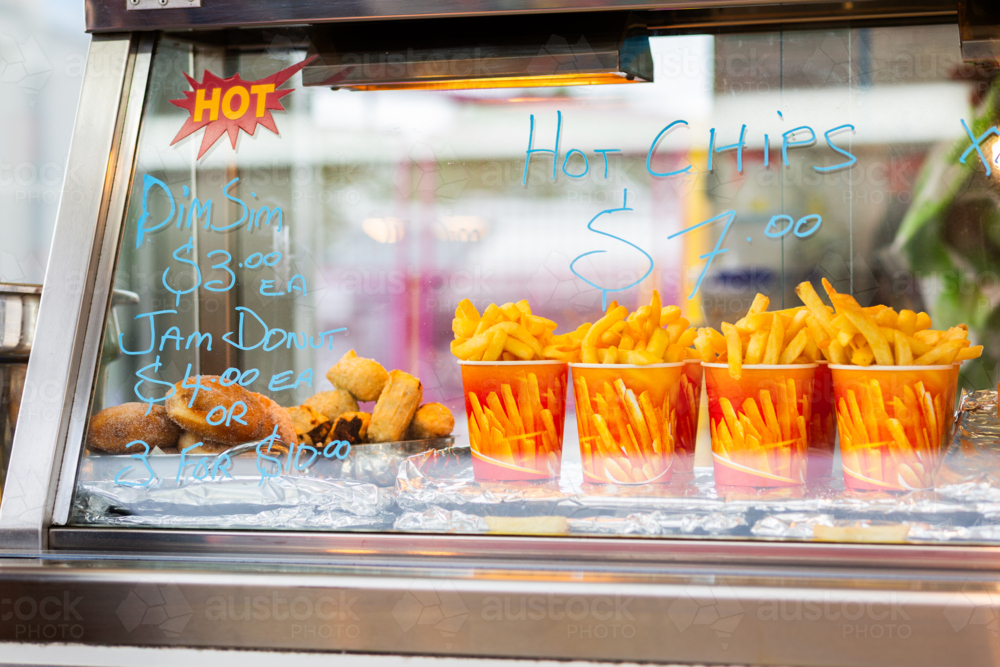 Sideshow Bucket Image of Hot chips in buckets and jam donuts at sideshow food stall at ...