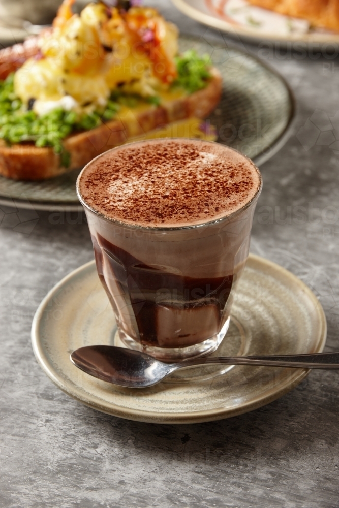 Hot chocolate with healthy meals in background - Australian Stock Image