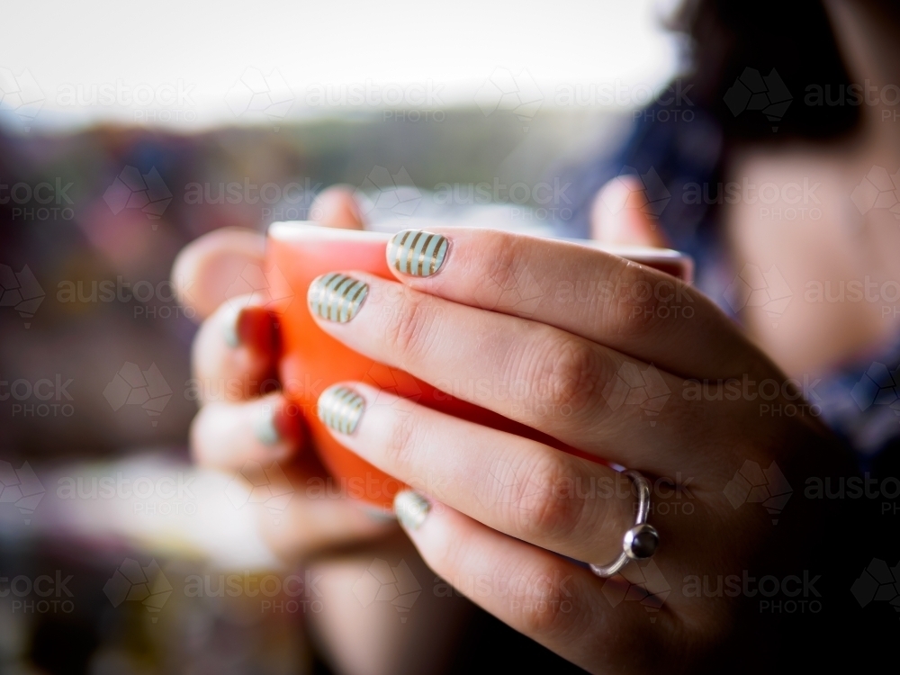 Hot Coffee in warm hands on a Cold Morning - Australian Stock Image