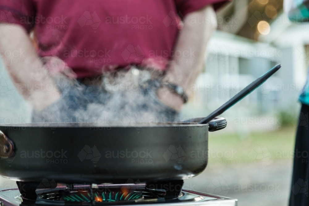 Hot pot on camp burner - Australian Stock Image