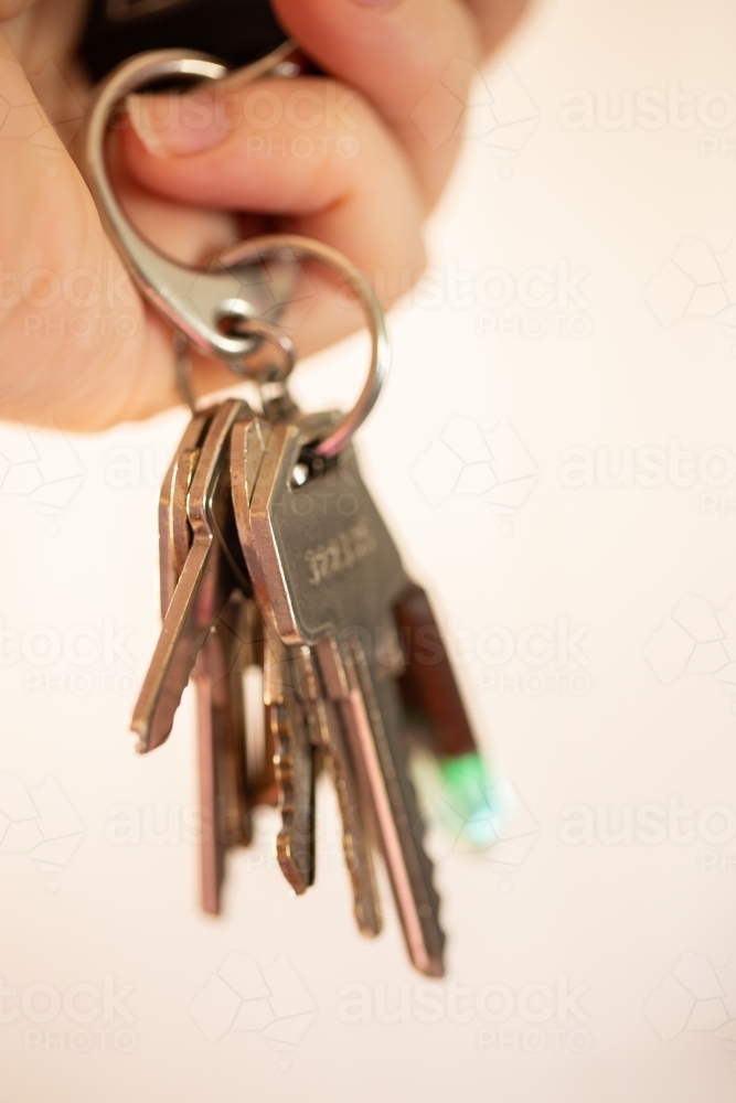 House keys and car keys on keyring close up - Australian Stock Image