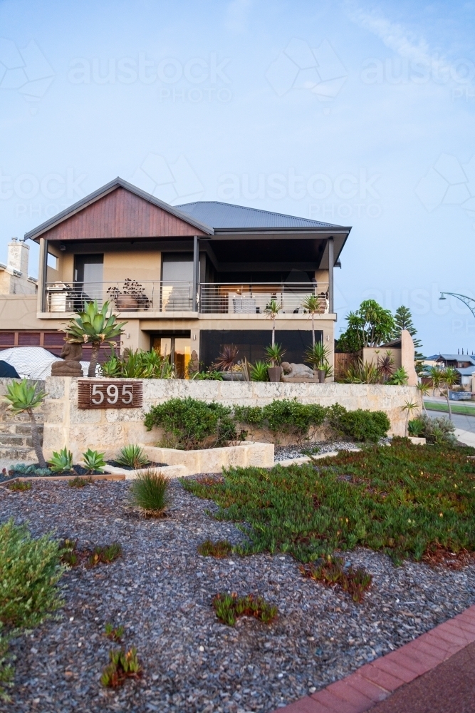 House on street corner in coastal suburb - Australian Stock Image