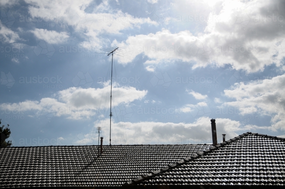 House roof tiles reflecting sunlight - Australian Stock Image