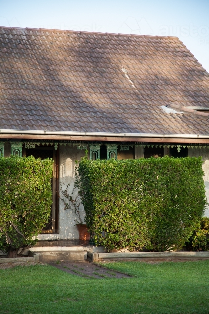 House with a hedge at the entrance - Australian Stock Image