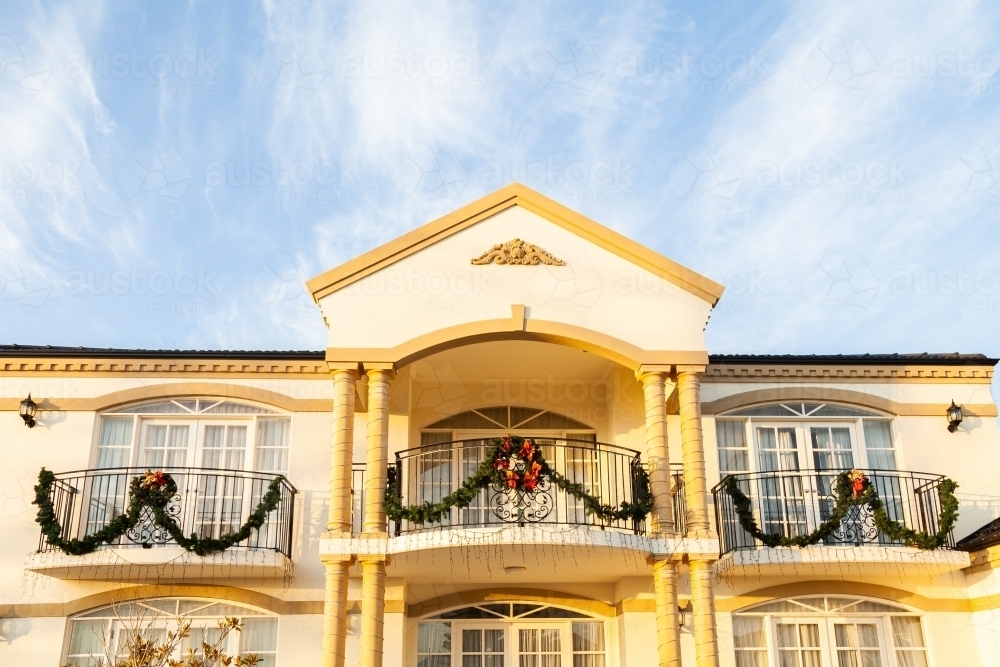 House with Christmas lights and decorations on balcony - Australian Stock Image