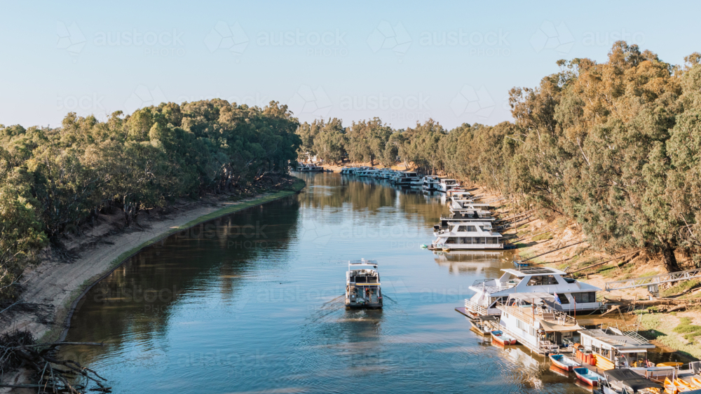 Houseboat cruising Murray River - Australian Stock Image