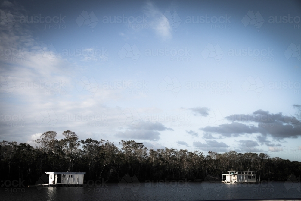 Houseboats on river - Australian Stock Image