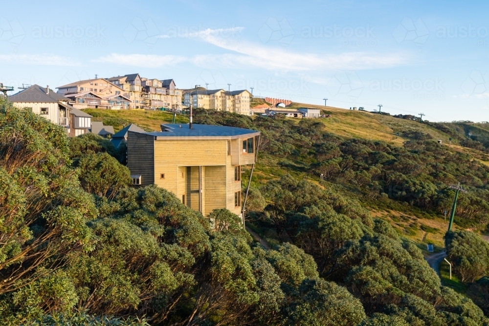 houses and units on the hill at Mt Hotham, summertime - Australian Stock Image