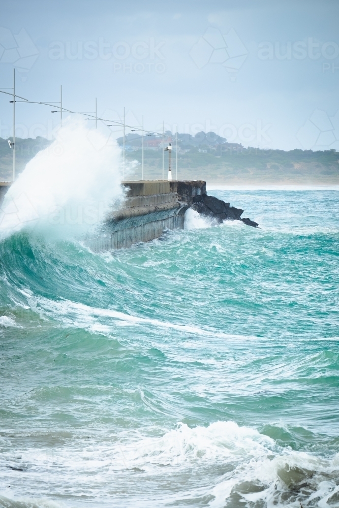 Huge sea crashes into break wall - Australian Stock Image