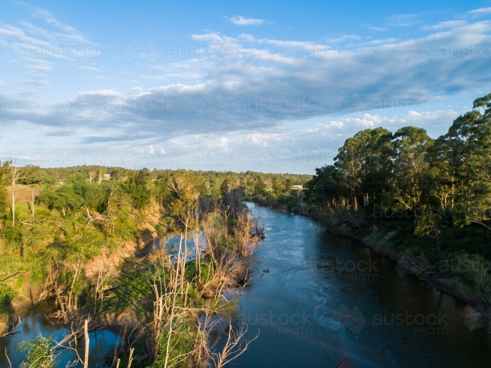 Hunter river in afternoon light reflecting blue summer sky in NSW Australia - Australian Stock Image