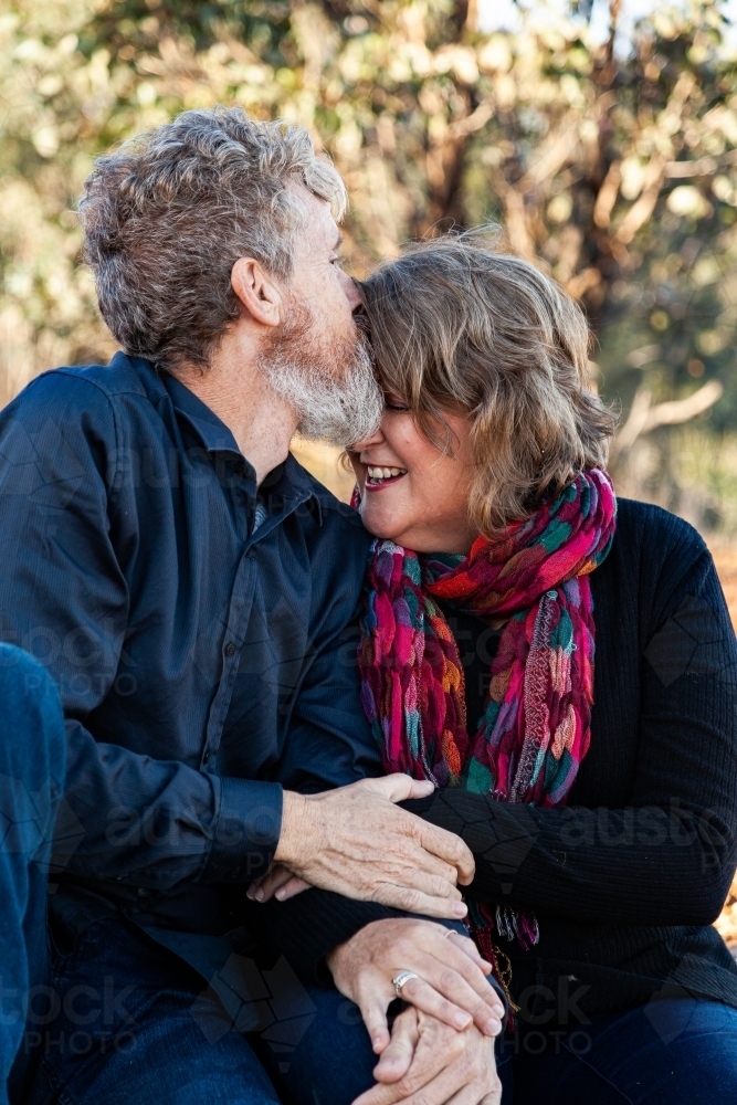 Husband kissing wife - Australian Stock Image
