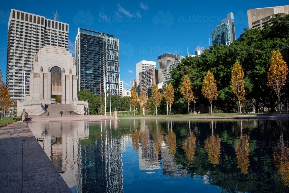 Hyde Park and Anzac Memorial with reflections of trees in water - Australian Stock Image