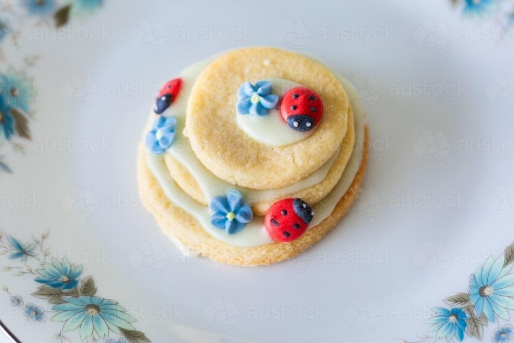 Image of Icing sugar ladybugs on stacked biscuits birthday party treats ...