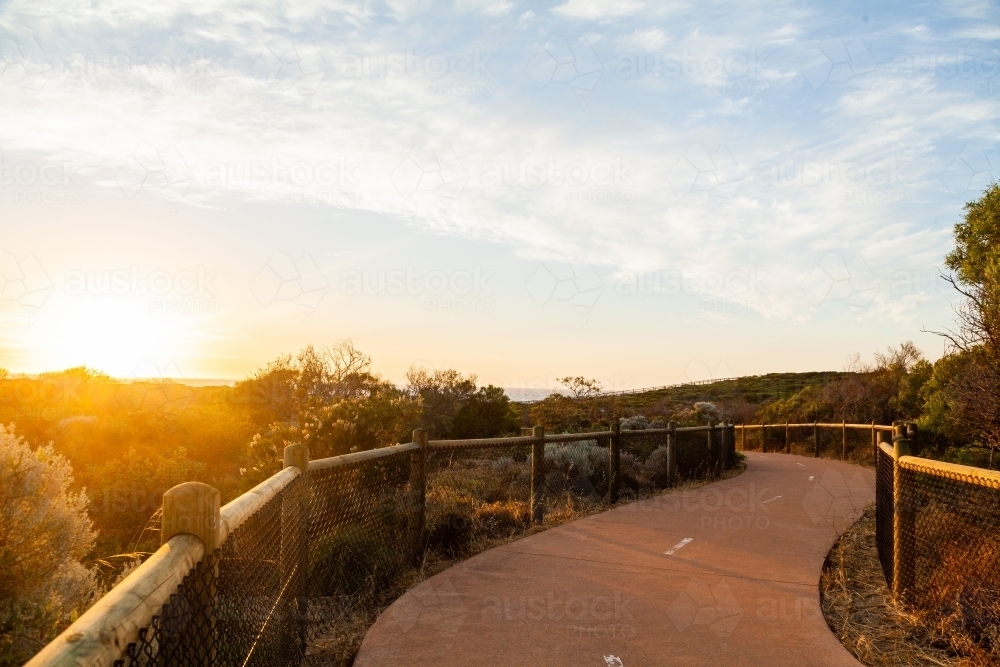 Image of Iluka coastal walk at sunset, walking path between natural