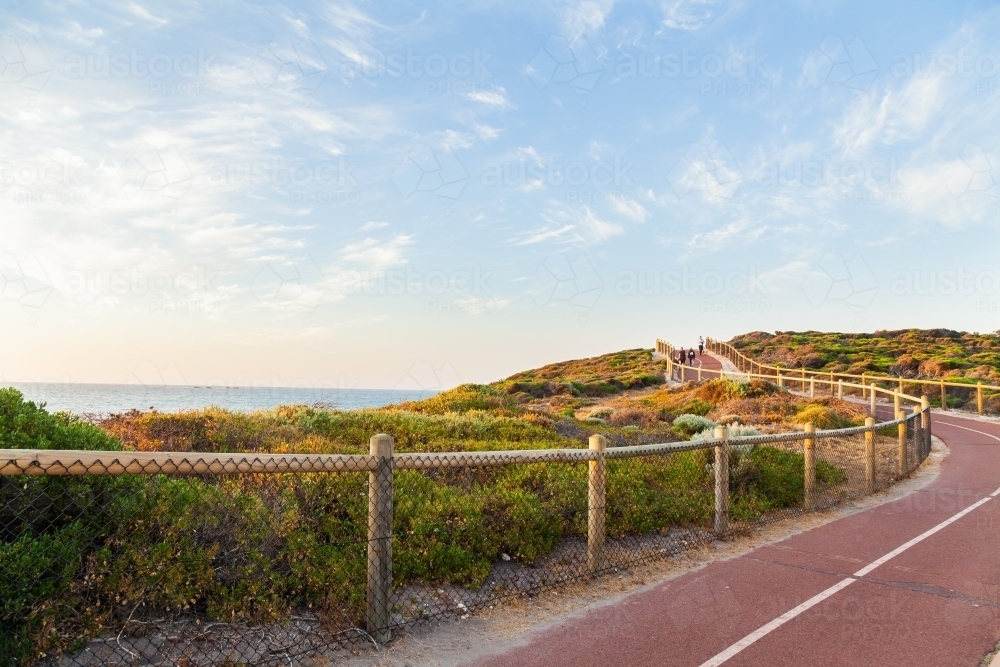 Iluka coastal walk at sunset, walking path between natural coastal vegetation - Australian Stock Image