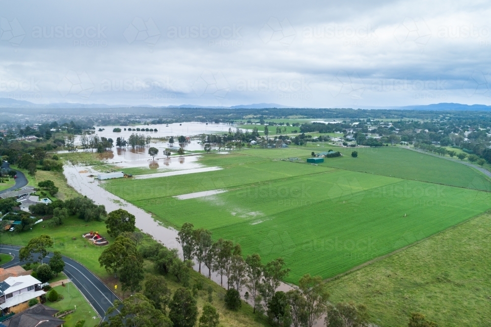 Image of rain over flooding farmland in Hunter Valley