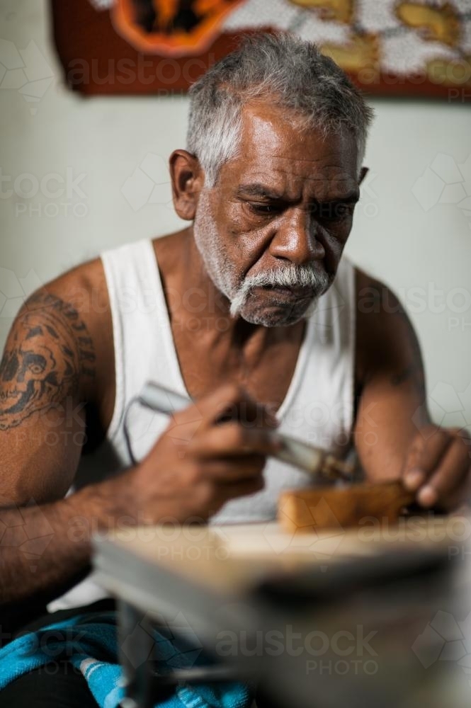 Indigenous Australian Artist at work - Australian Stock Image