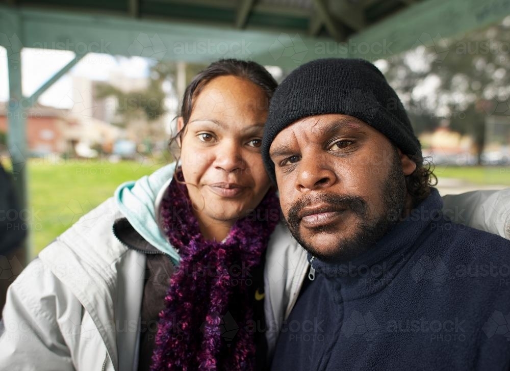 Indigenous Australian Man and Woman in a Shelter - Australian Stock Image