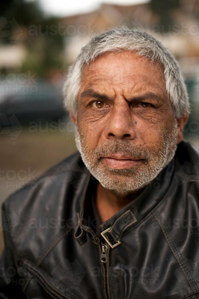 Indigenous Australian Man in Black Leather Jacket - Australian Stock Image