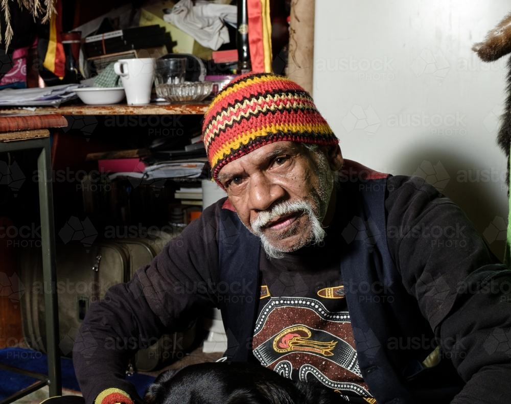 Indigenous Australian Man wearing colourful beanie - Australian Stock Image