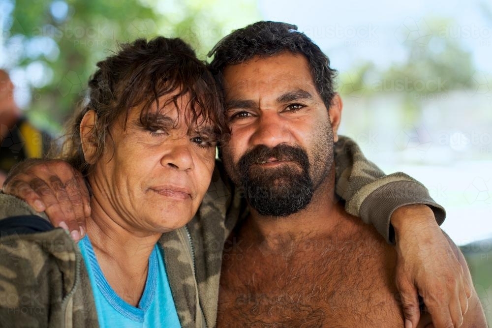 Indigenous Woman with Arm around Man - Australian Stock Image