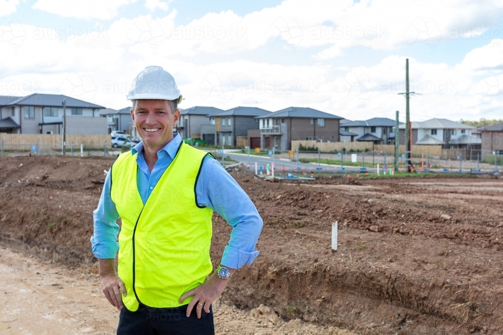 Individual property developer standing on-site - Australian Stock Image