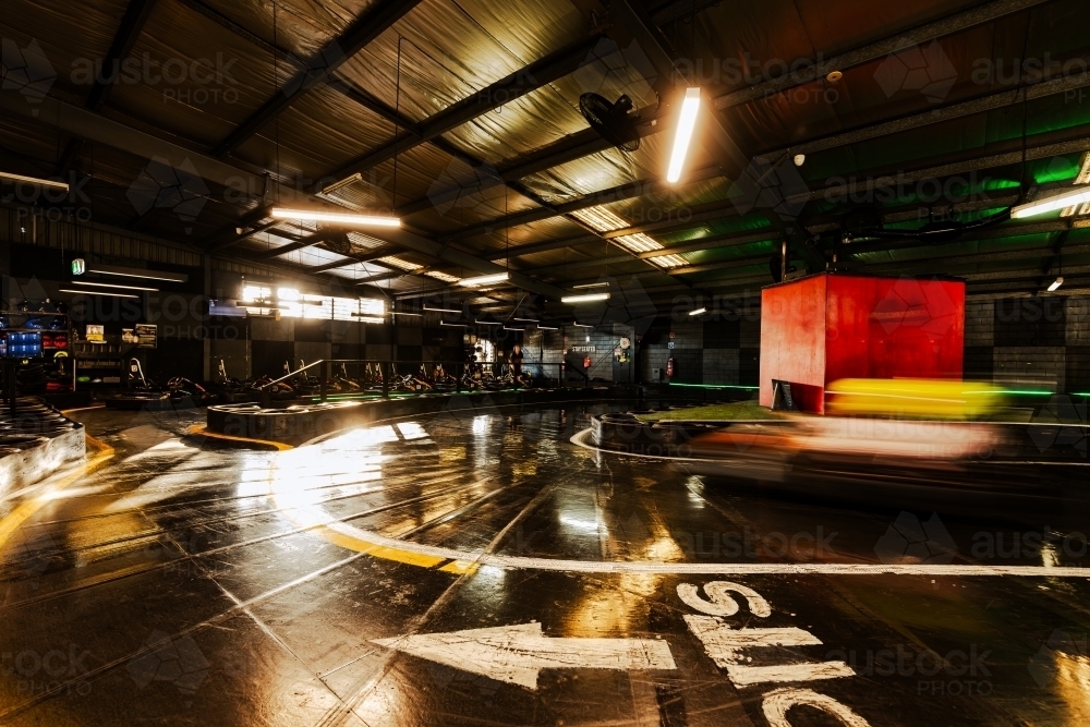 Accelerate Speed Image of Indoor Go Kart race track with motion blur - Austockphoto