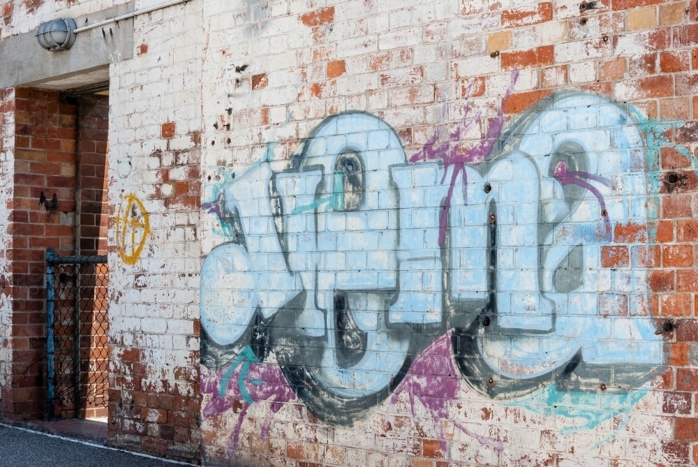 Industrial Building with Graffiti on a wall - Australian Stock Image