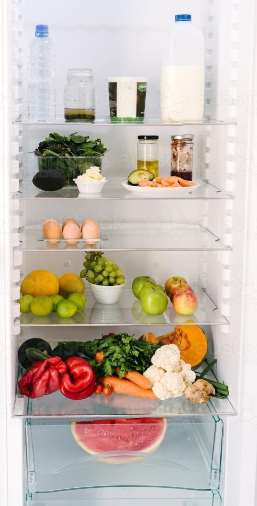 inside the healthy person's fridge, lots of fruit, veg, dairy and eggs - Australian Stock Image