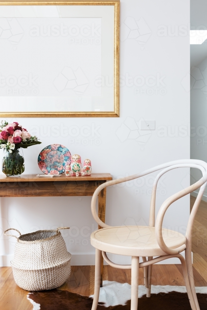 Interior decoration styled with chair and side table and blank wall frame - Australian Stock Image