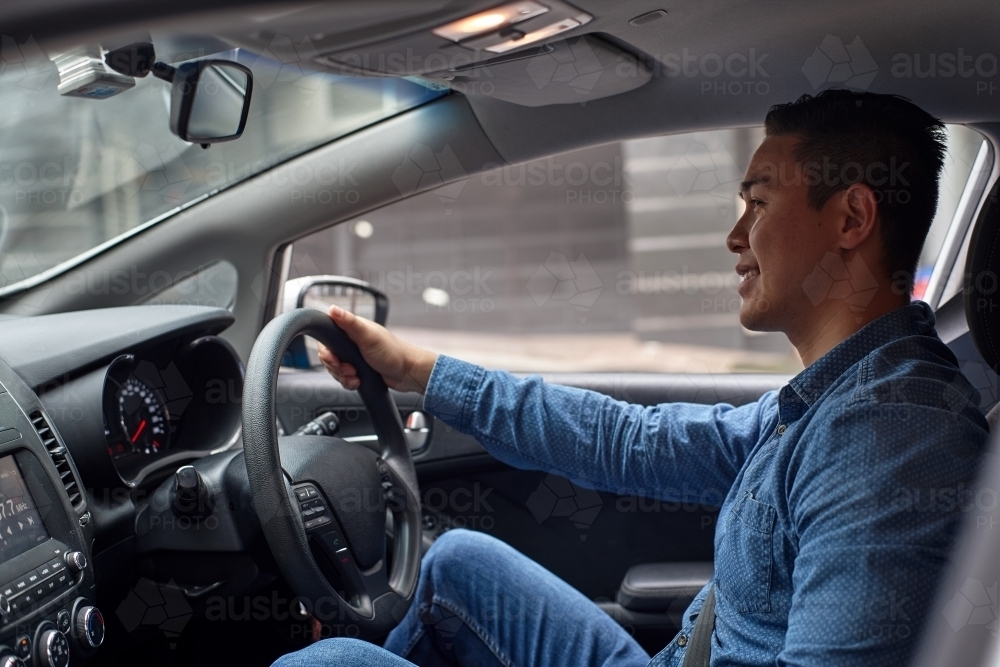 Interior of man driving car - Australian Stock Image