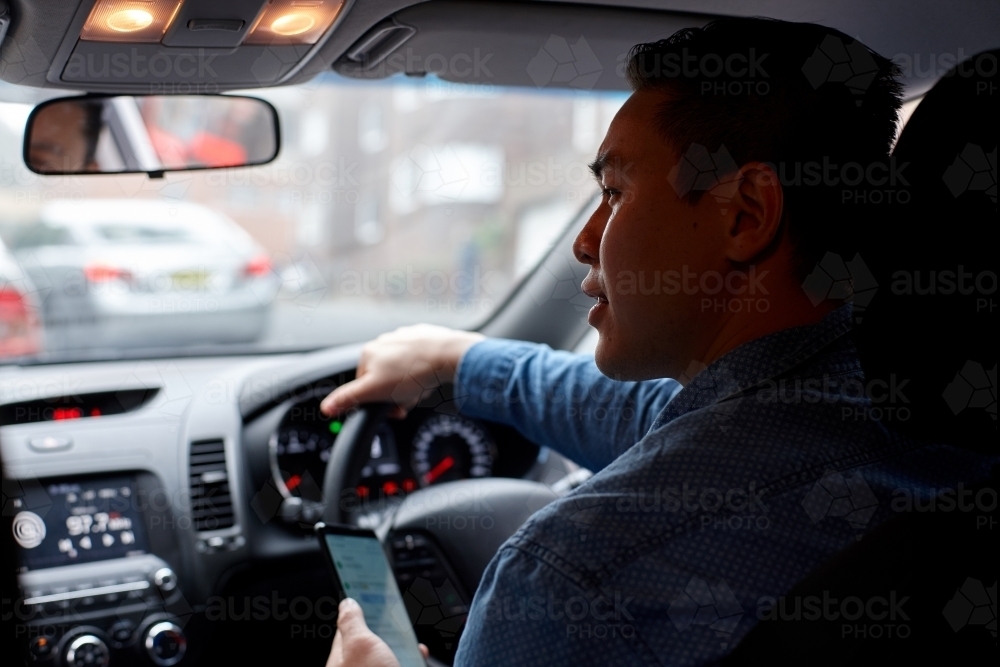 Interior of man driving car - Australian Stock Image