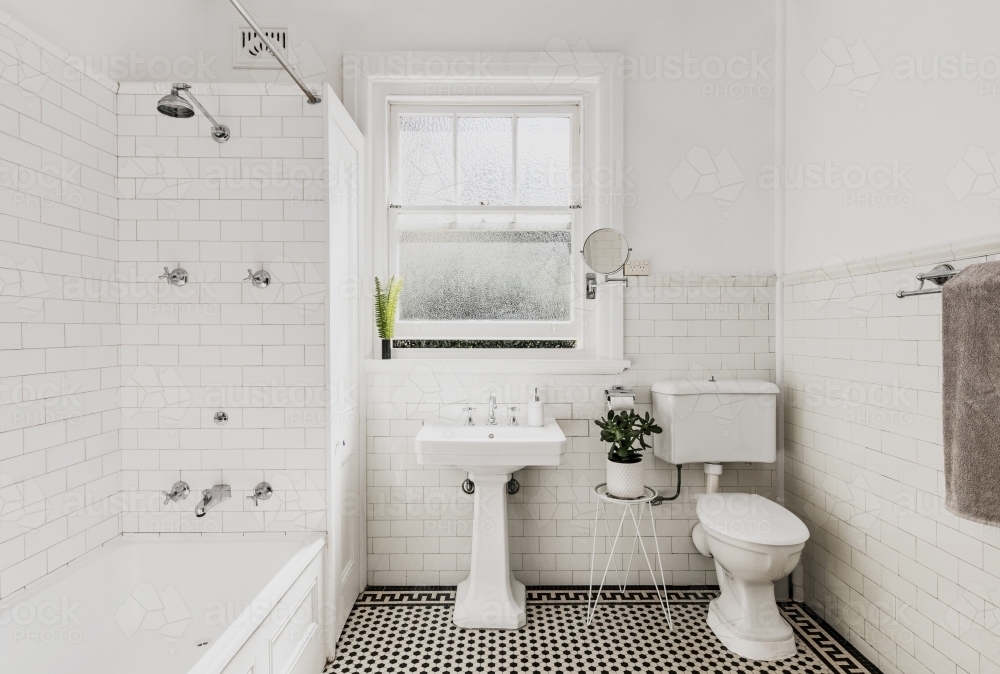 Interior of white tiled bathroom - Australian Stock Image