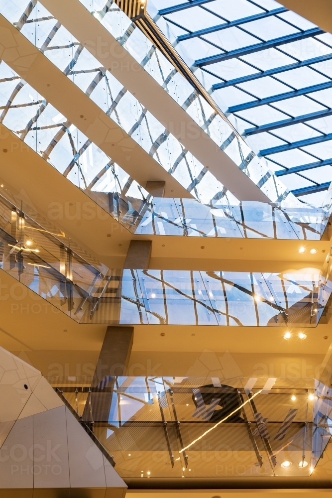 Image of Interior view of a multi levelled shopping centre with glass